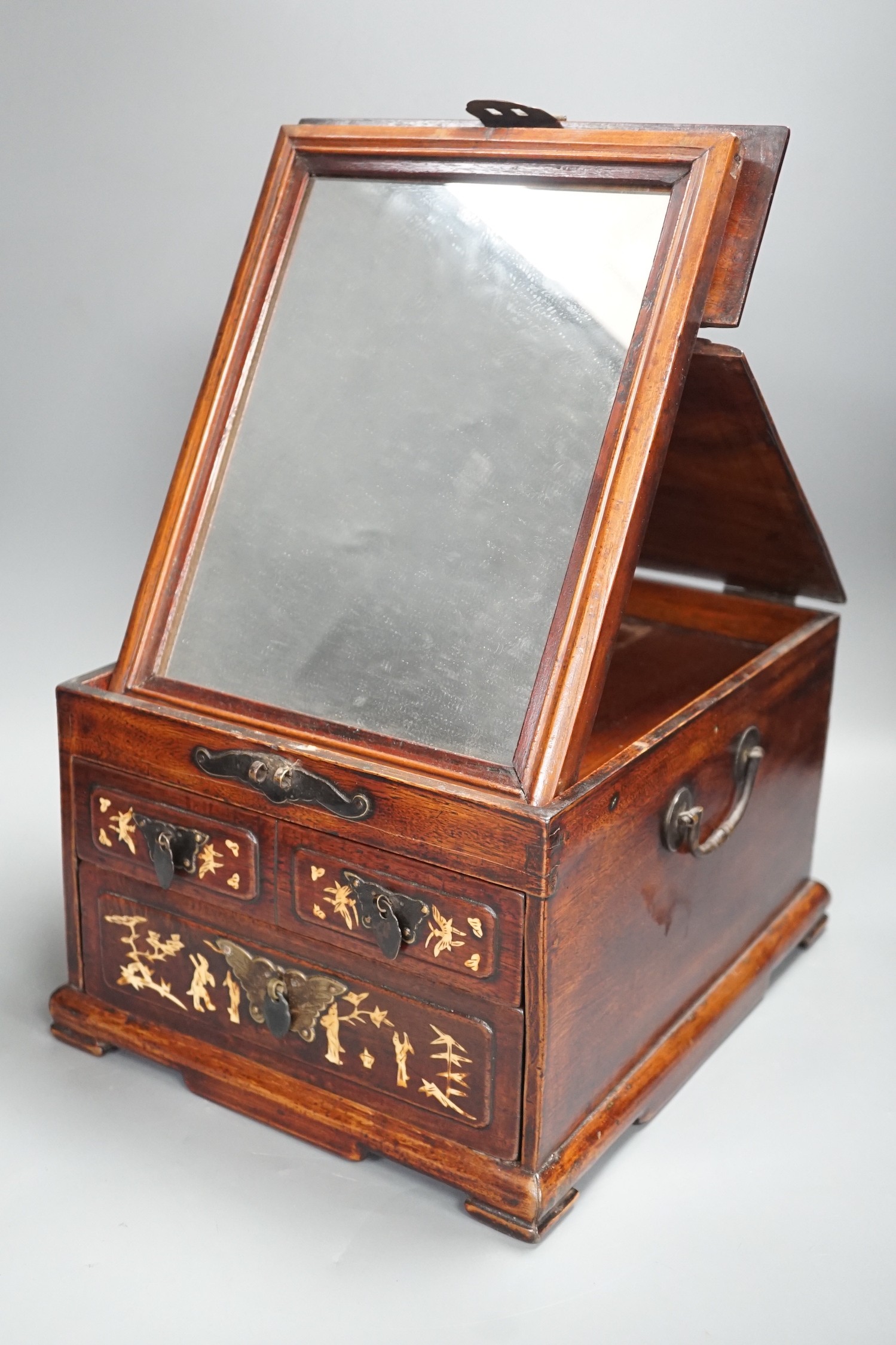 A late 19th century Chinese hardwood and bone inlaid jewellery box. 18.5cm tall